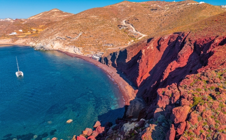 Red cliffs in red beach Santorini
